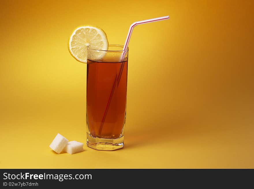 Glass of tea with lemon and sugar