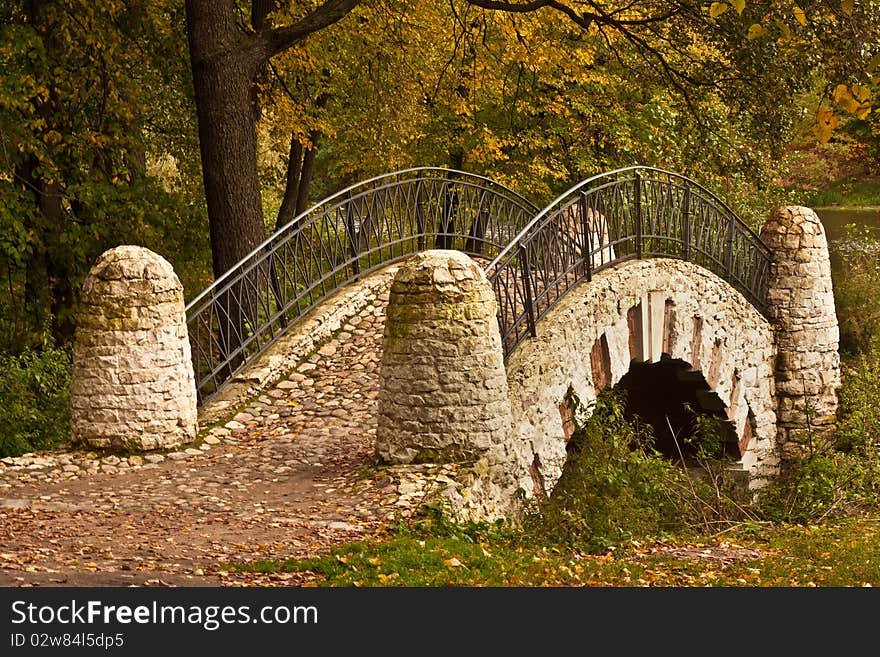 Autumnal image of the bridge over the river. Autumnal image of the bridge over the river