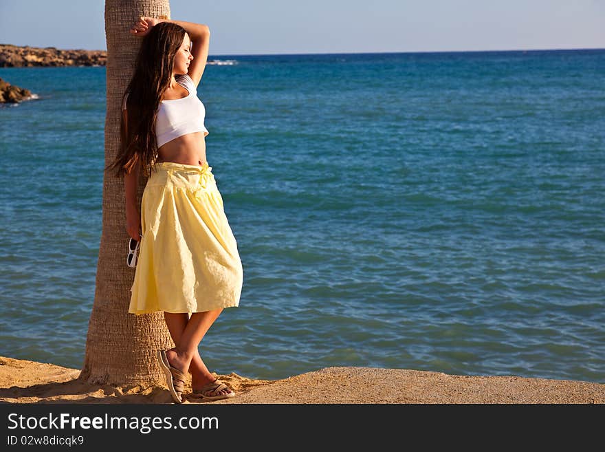 Woman Is Standing Near The Palm Tree