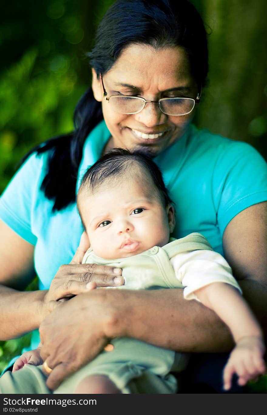 A happy scene of a grandmother and a newborn baby. A happy scene of a grandmother and a newborn baby