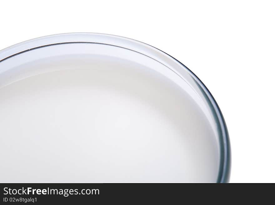 Glass of milk close-up, isolated on white