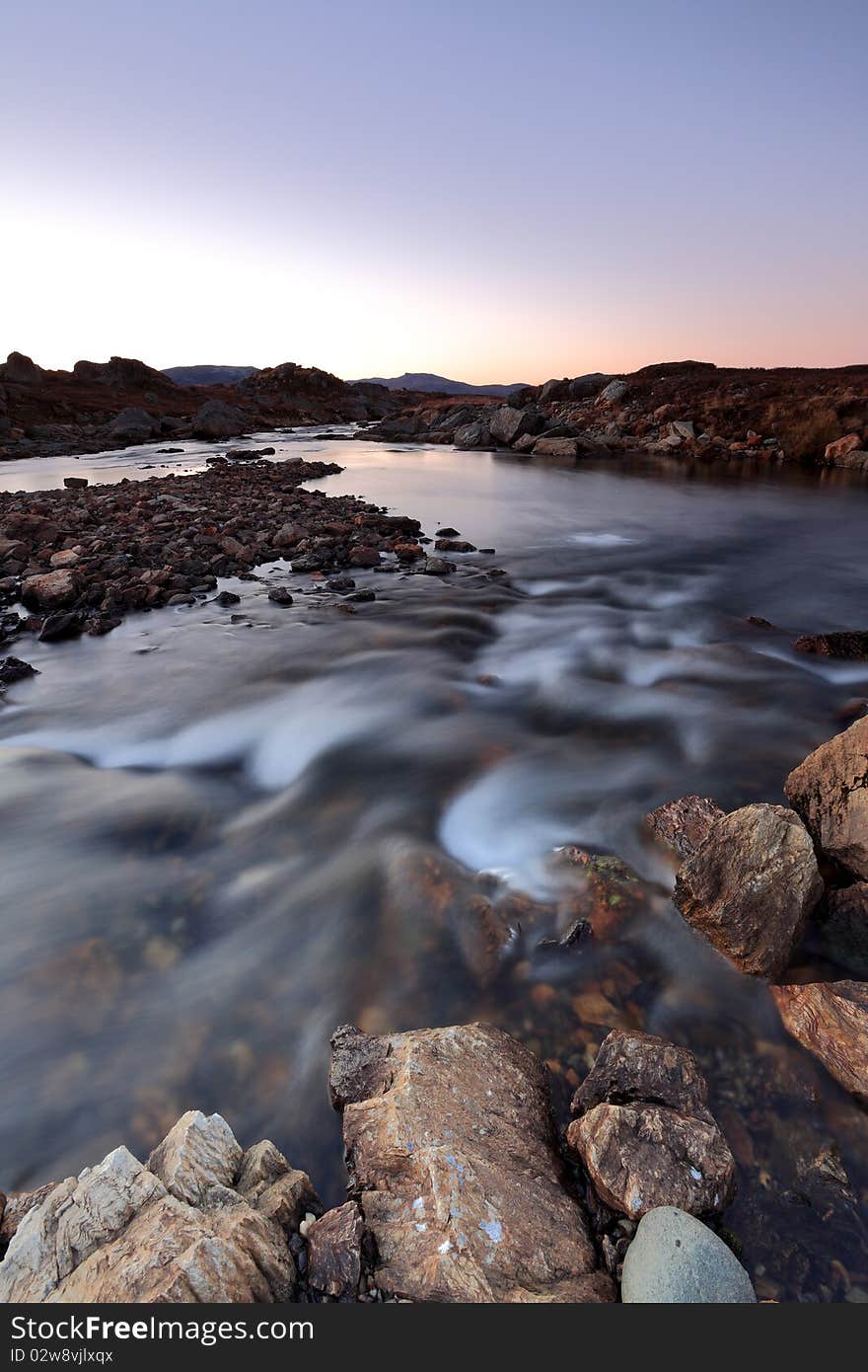 A mountain stream in the evening light. A mountain stream in the evening light