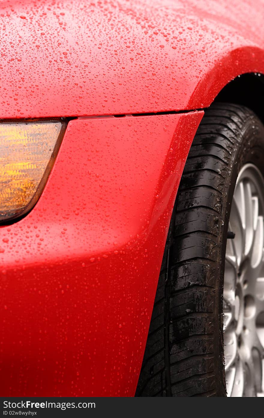 Water drops on an red sport car