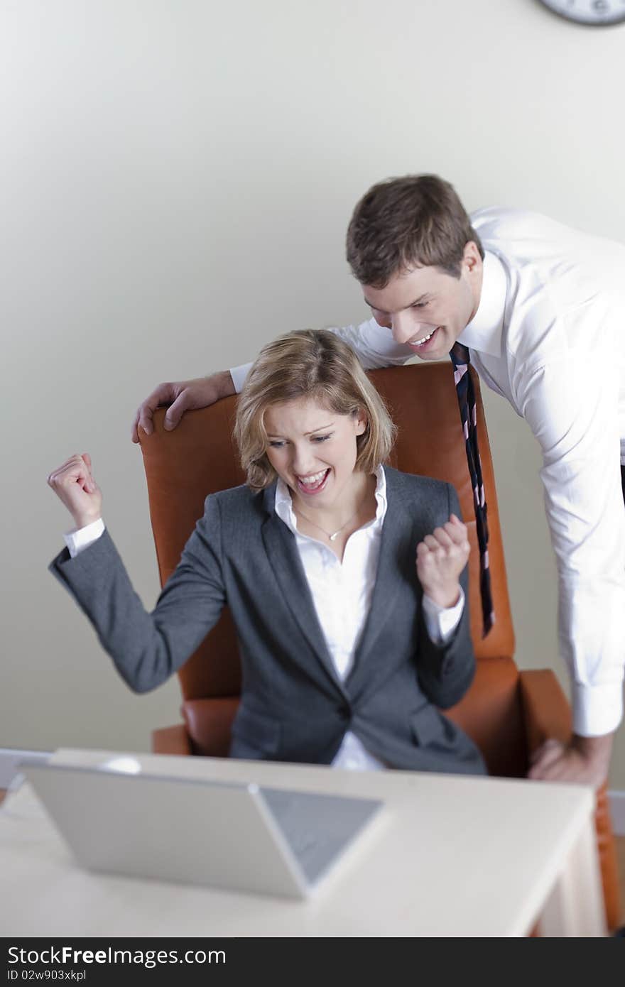 Happy business couple in the office