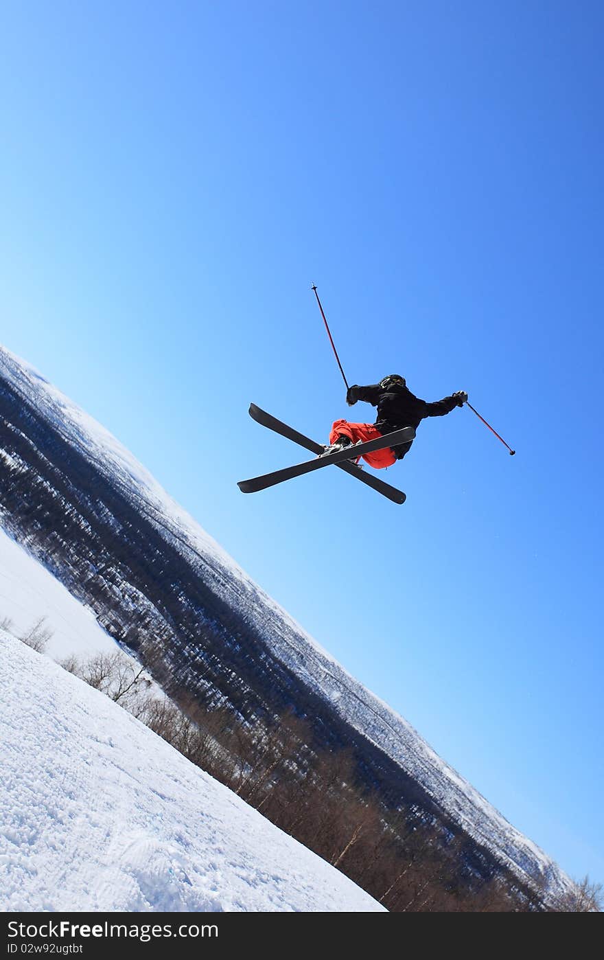 Young skier who jump high up in the air. Young skier who jump high up in the air