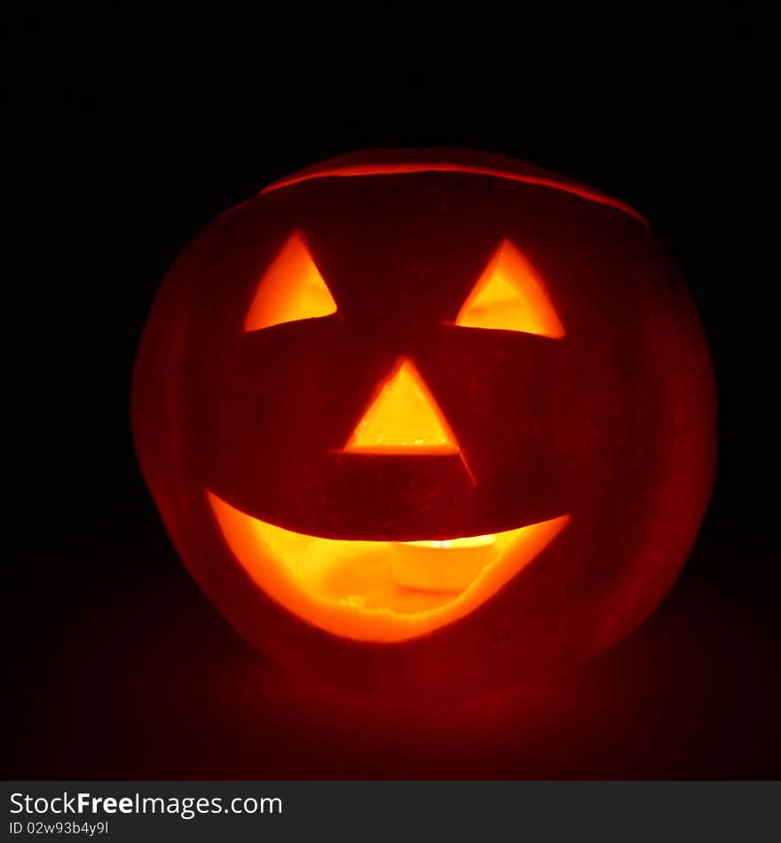 Jack-o-lantern glowing on black background