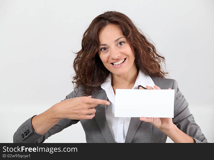 Smiling businesswoman showing business card. Smiling businesswoman showing business card