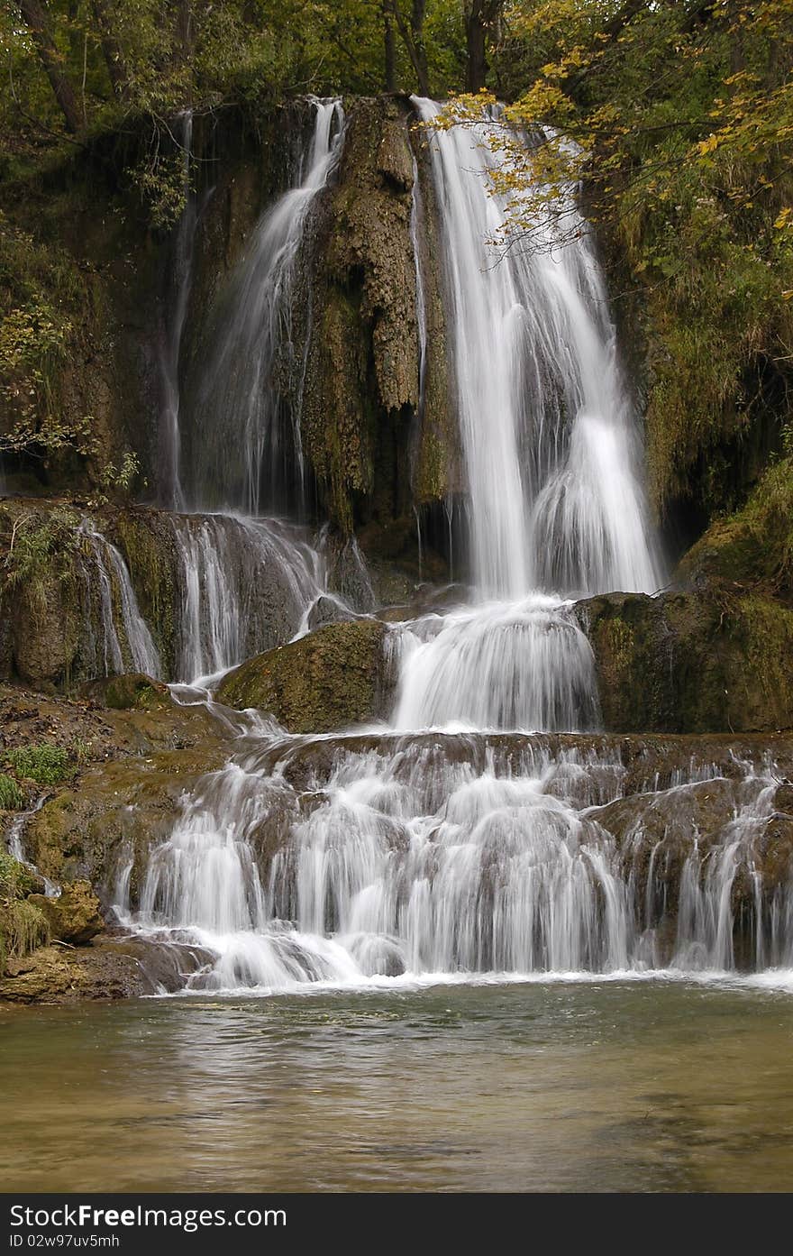 Waterfall in the middle of the village in central Slovakia Lucky