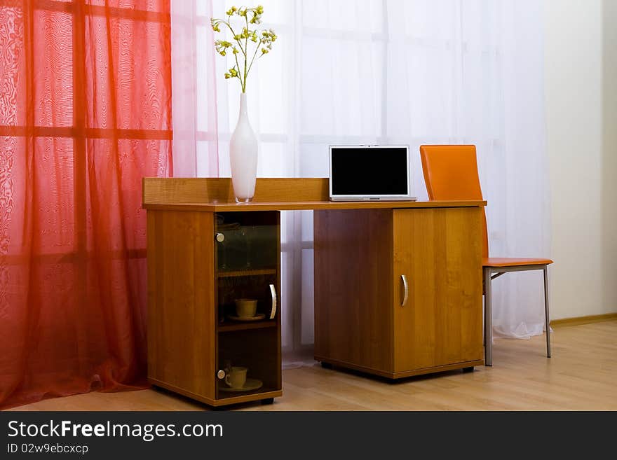 New and modern laptop on a table in an apartment