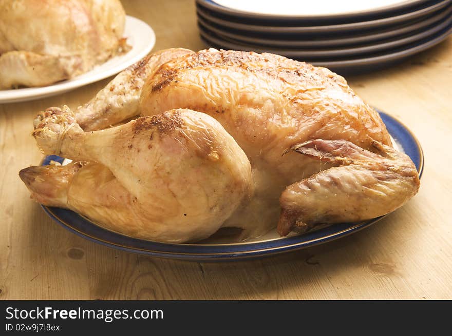 Delicious Roasted Chicken ready to serve at the kitchen table