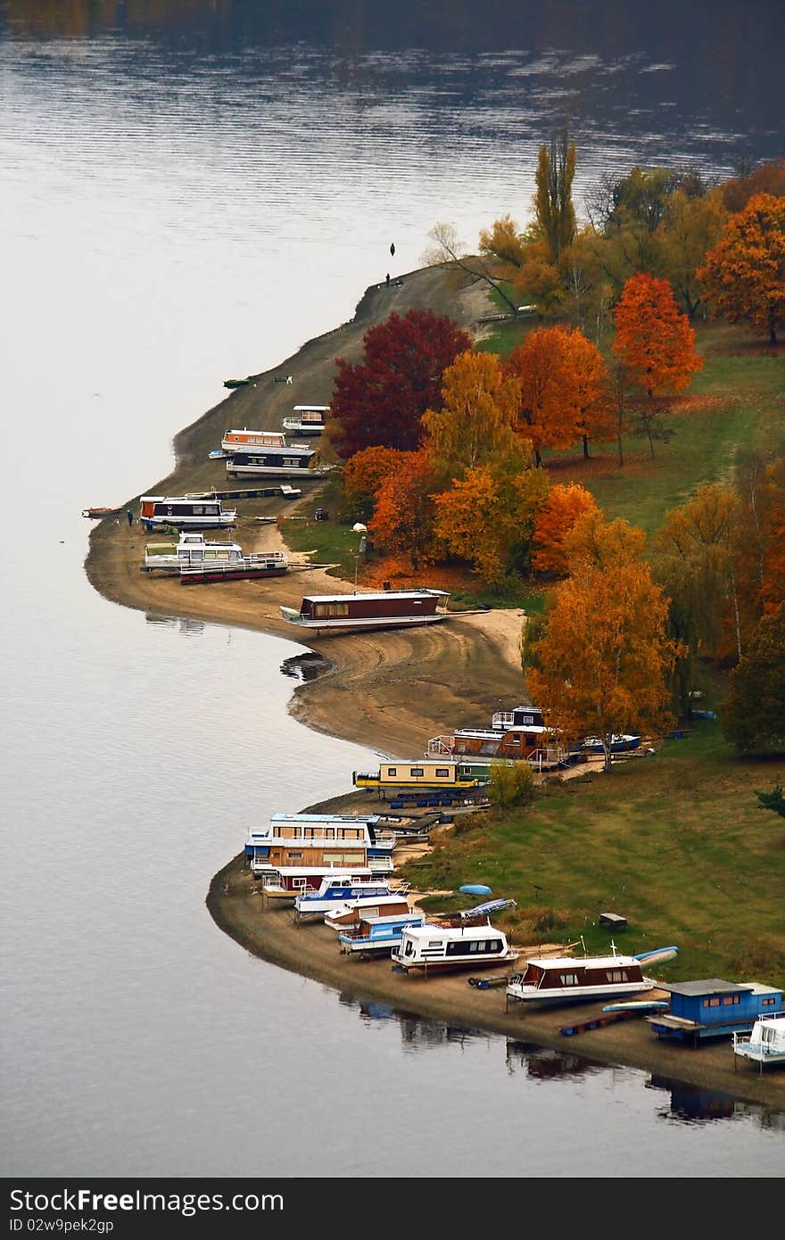 Several houseboats on the coast in autumn. Several houseboats on the coast in autumn.