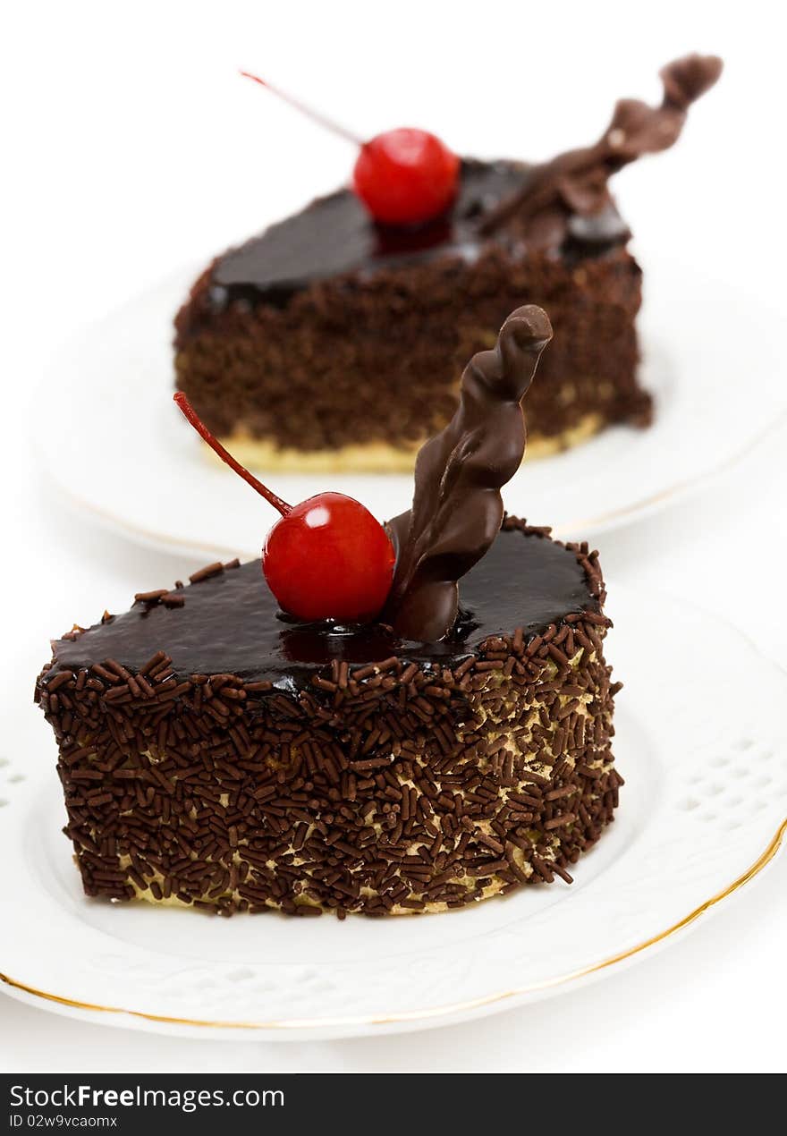 Chocolate cakes with red cherry