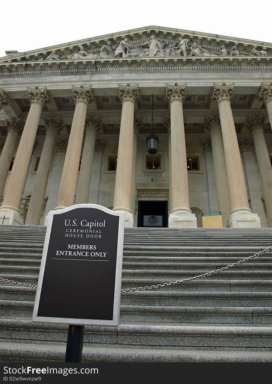 Sign in front of a door of the capitol