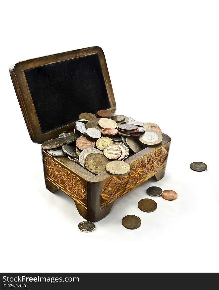 Coins from different countries in the chest. Coins from different countries in the chest