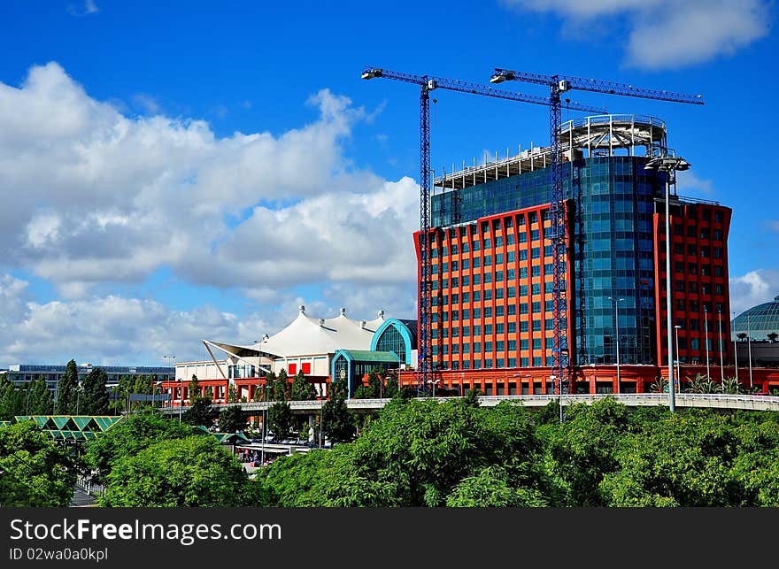 The modern architecture of glass against a backdrop of blue sky