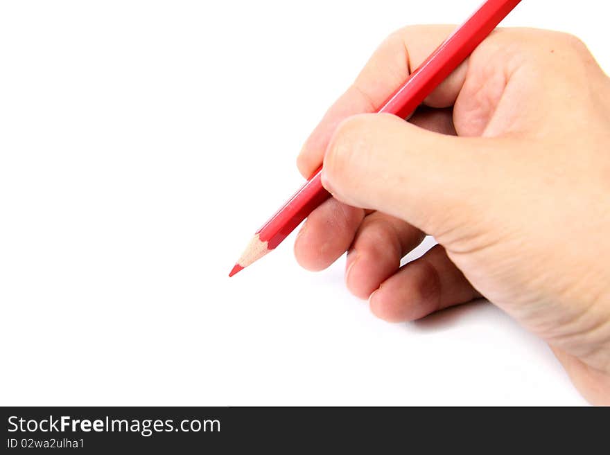 Hand holding a red pencil on white  background