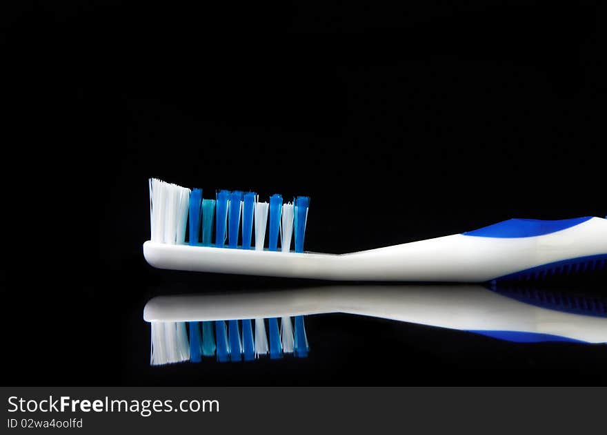 Tooth brush on black background ready to use as is or cut out for your next project.