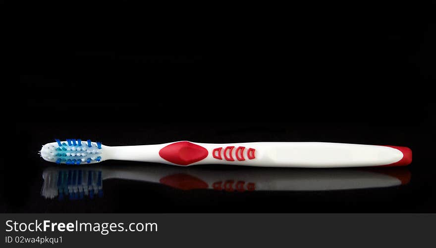 Tooth brush on black background ready to use as is or cut out for your next project.