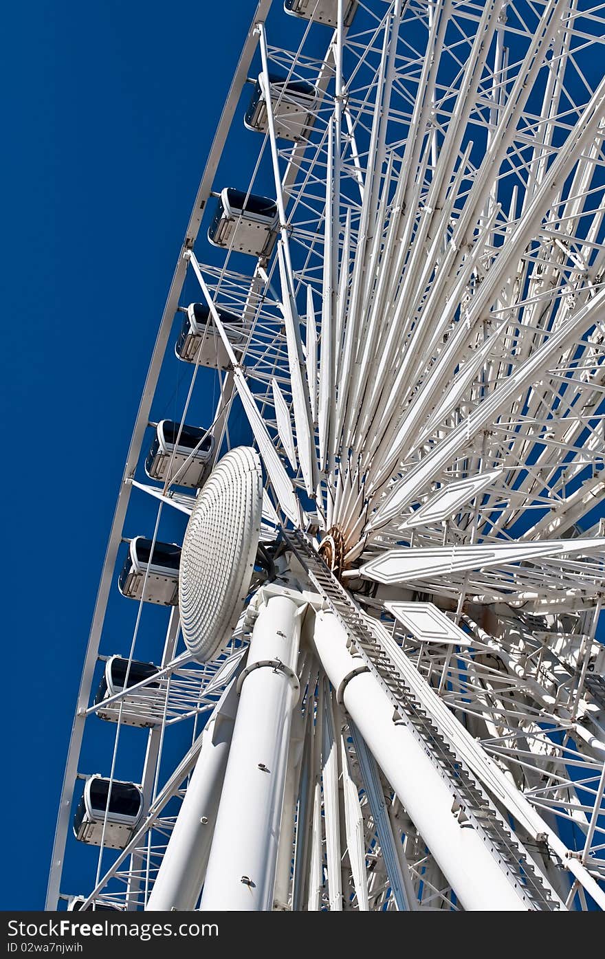 Large White Ferris Wheel with Enclosed Cars