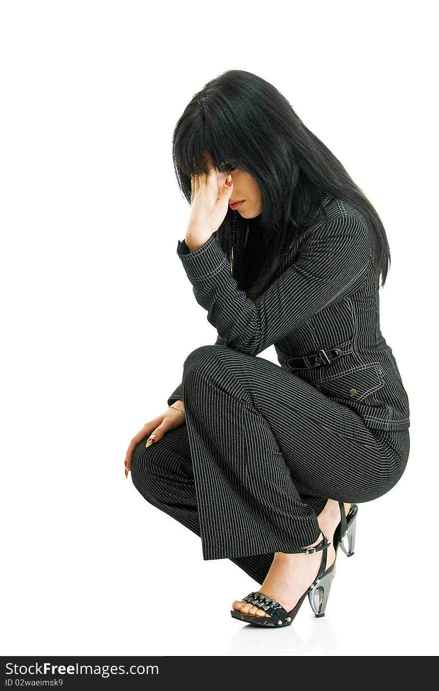 Young pretty business lady sits on white background. Young pretty business lady sits on white background