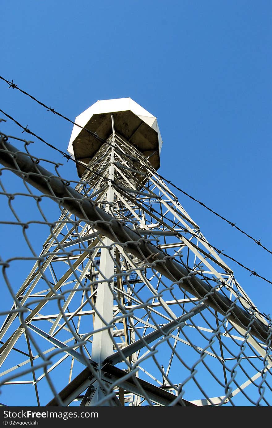 Weather Doppler with fence topped with barb wire surrounding it.