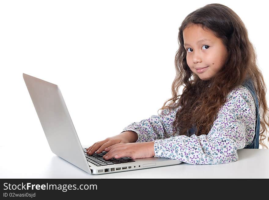 Girl sits before laptop