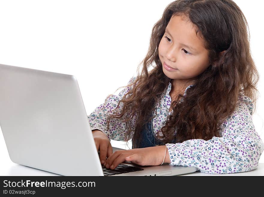 Girl sits before laptop