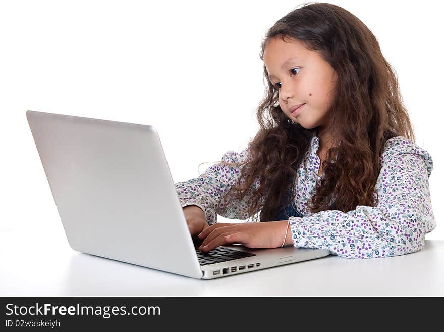 Girl sits before laptop