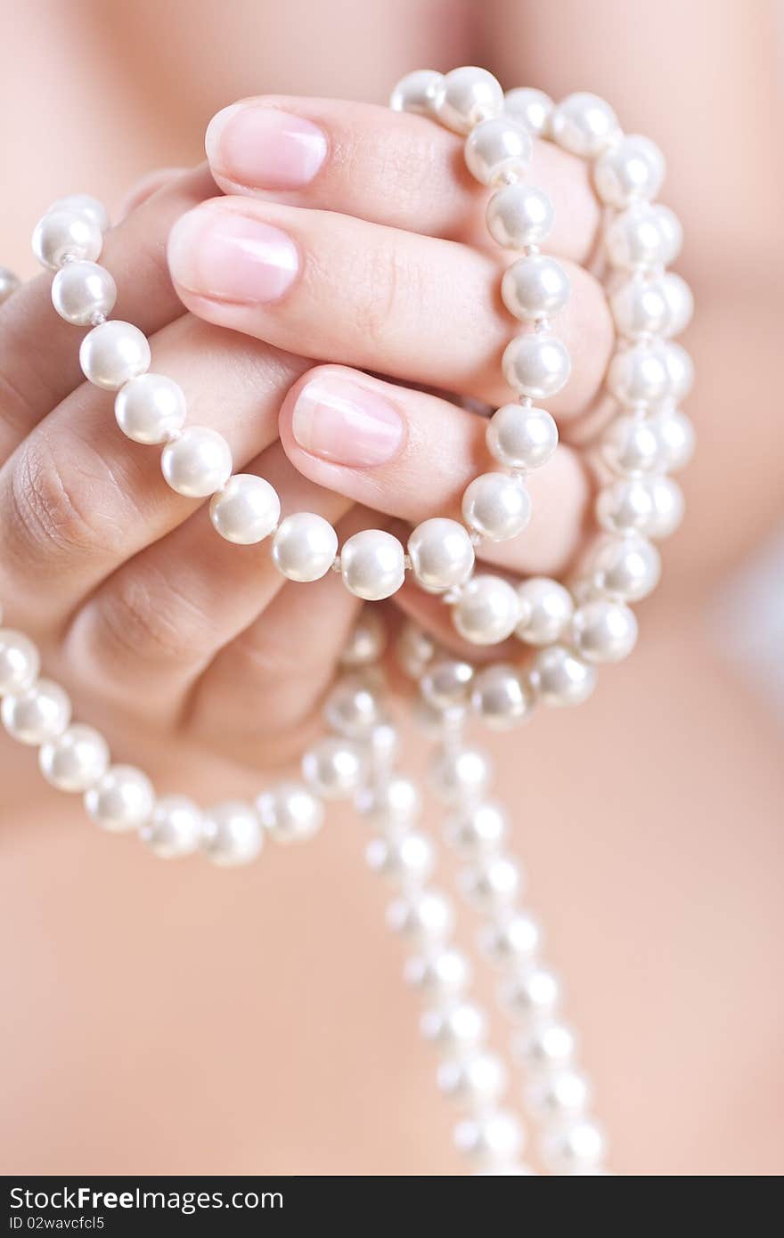 Pearls in the women s hands