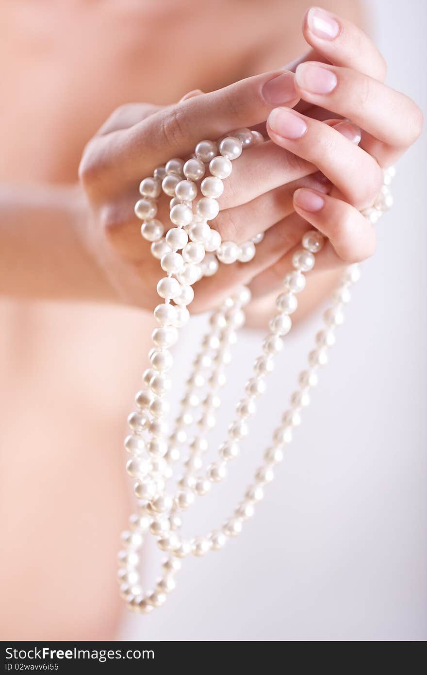 Pearls in the women s hands