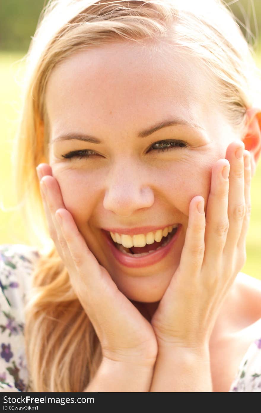 Outdoor portrait of laughing beautiful lady. Outdoor portrait of laughing beautiful lady