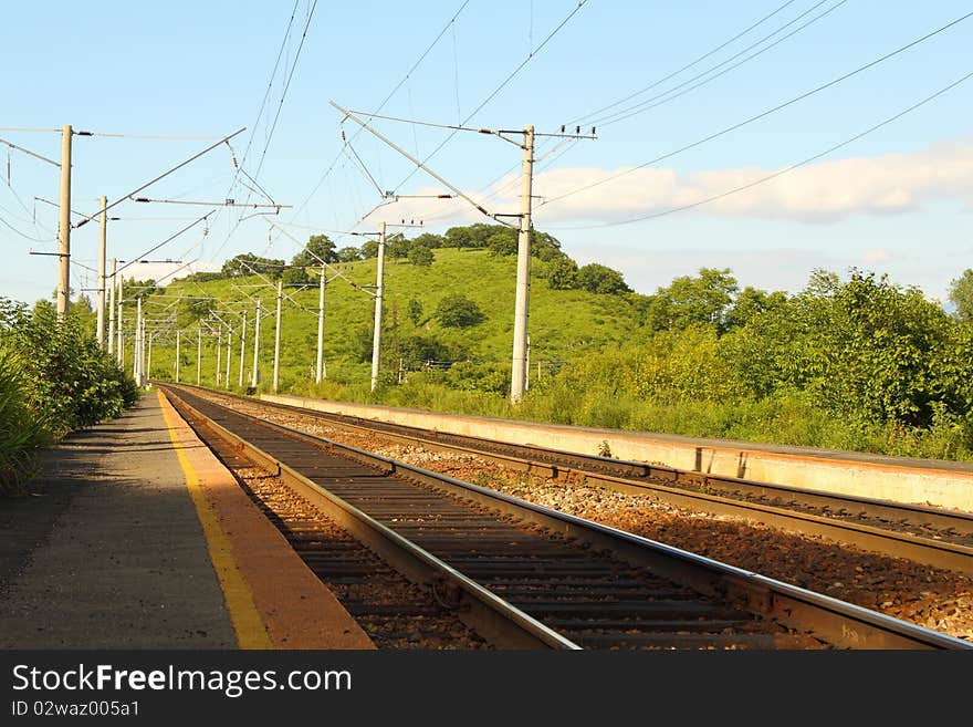 Two railway ways among hills and wood