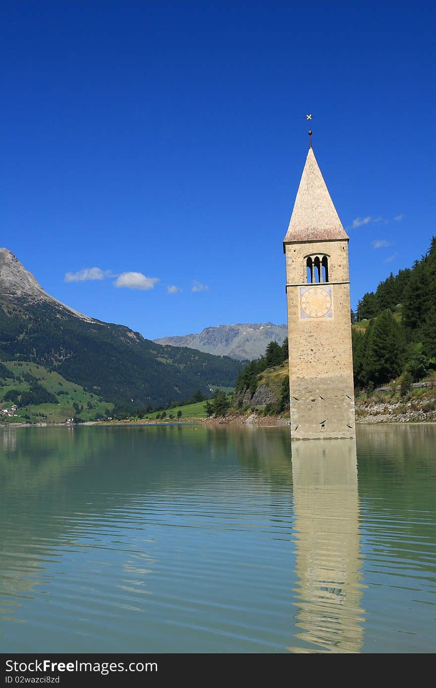 The bell tower is the last remains of Curon Vecchia, destroyed during the construction of the enormous artificial which was built to join the lakes of Curon and Resia, sacrificing a part of the town. The bell tower is the last remains of Curon Vecchia, destroyed during the construction of the enormous artificial which was built to join the lakes of Curon and Resia, sacrificing a part of the town.