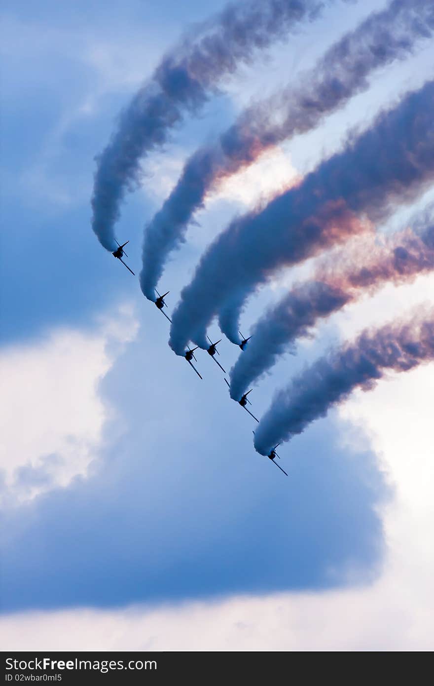 Flying demonstration with colored smoke