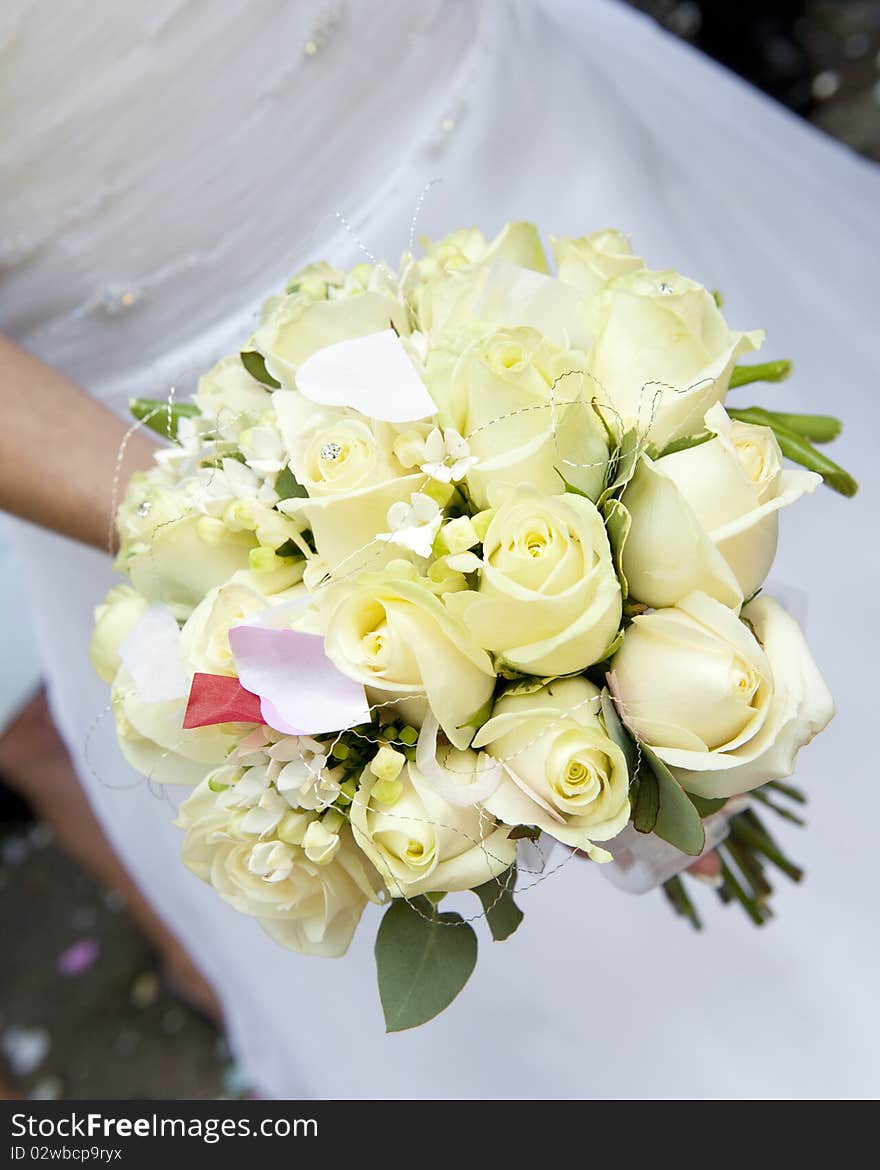 Bride's bouquet of cream roses with confetti