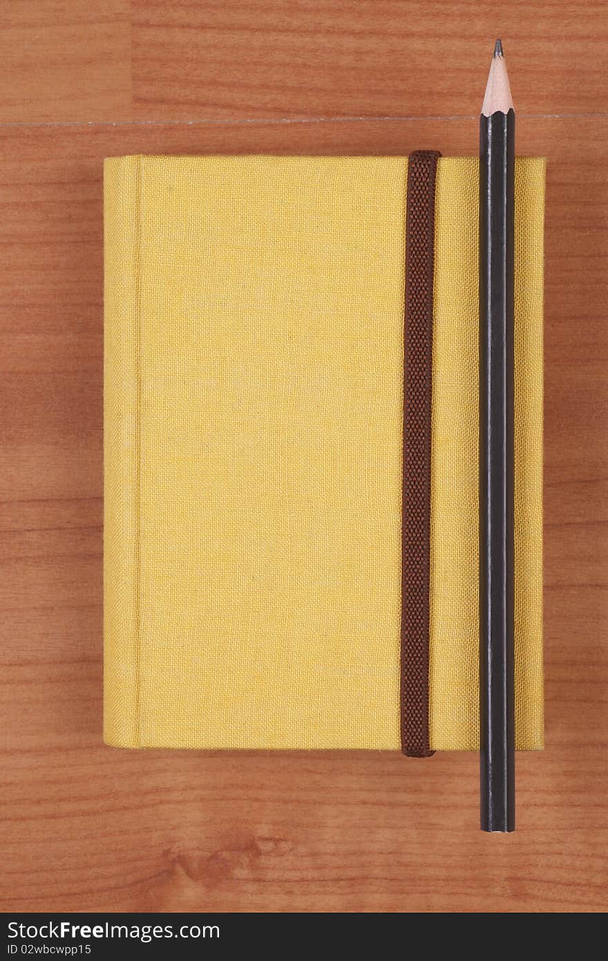 Yellow Notebook With Pencil