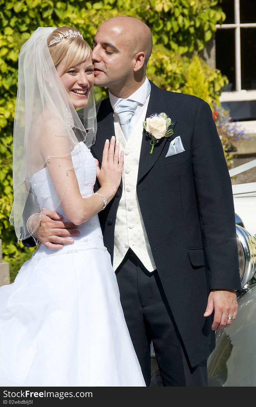 Beautiful bride and groom embracing on thier wedding day