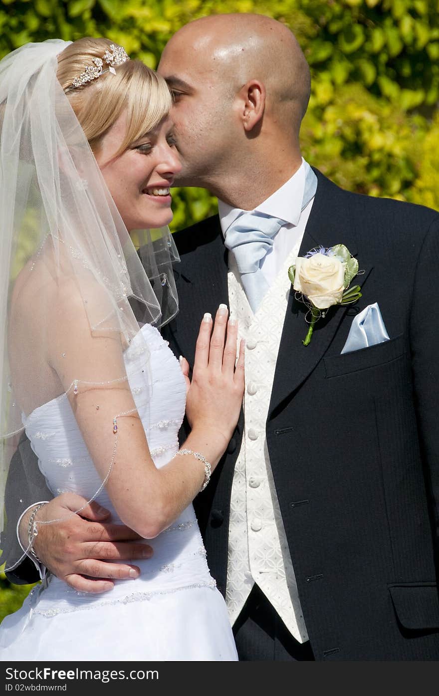 Intimate moment captured between a beautiful bride and groom