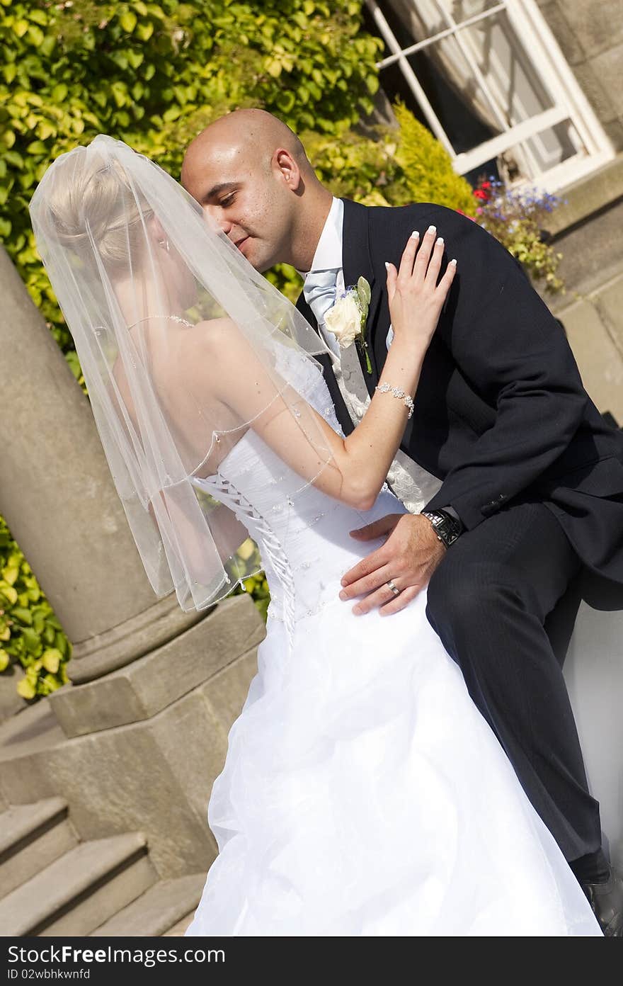 Intimate moment captured between a beautiful bride and groom