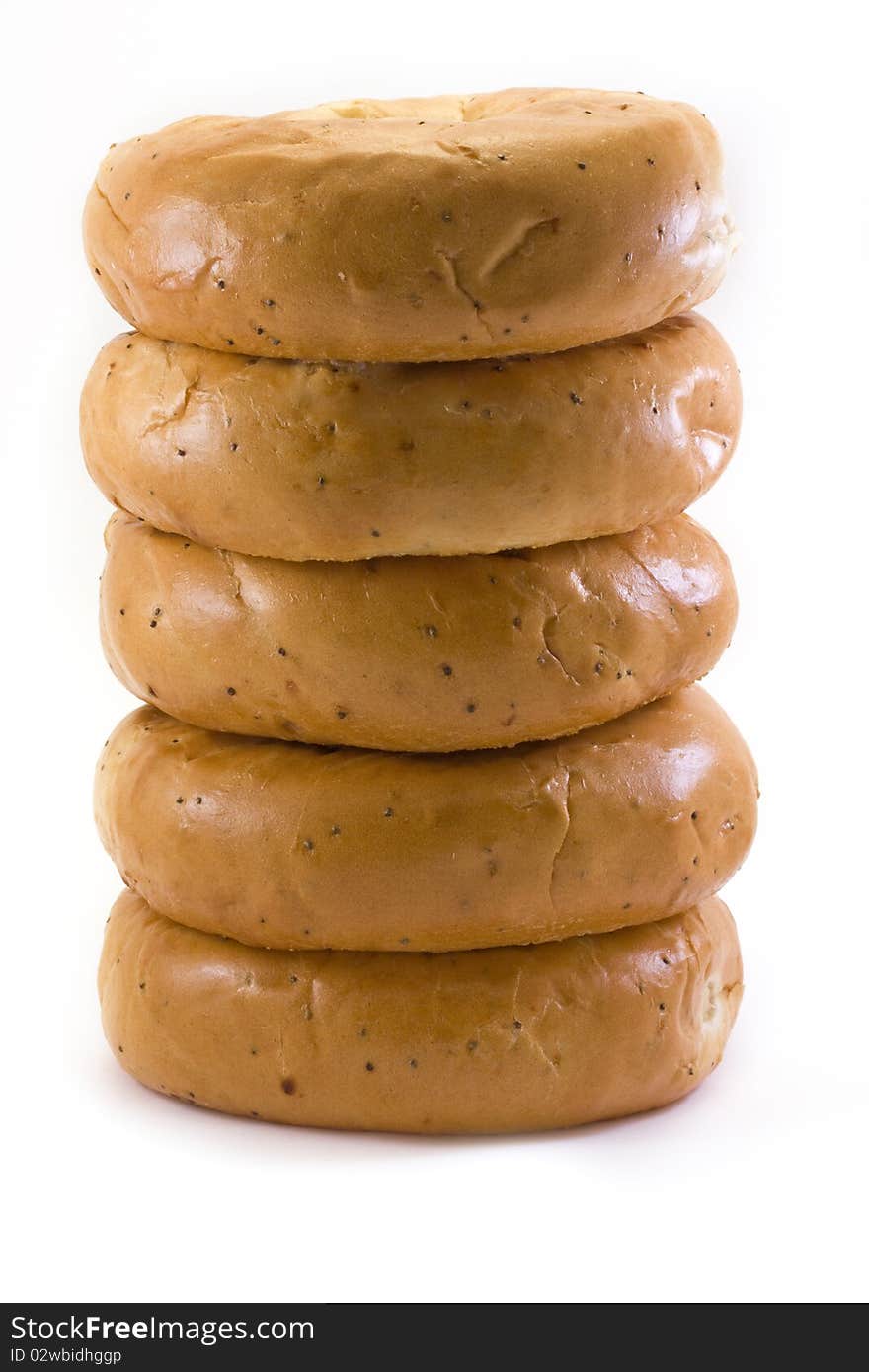 Stack of bagels over white