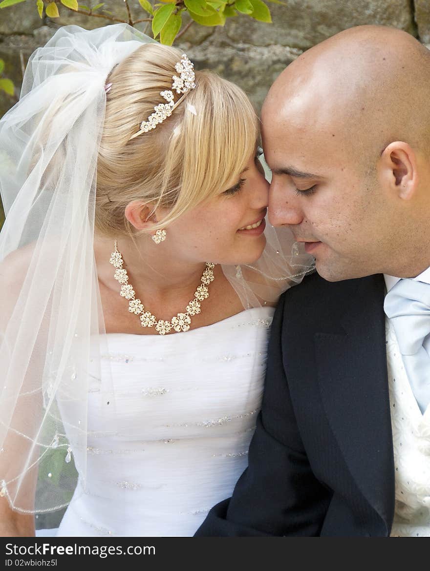 Intimate moment captured between a beautiful bride and groom