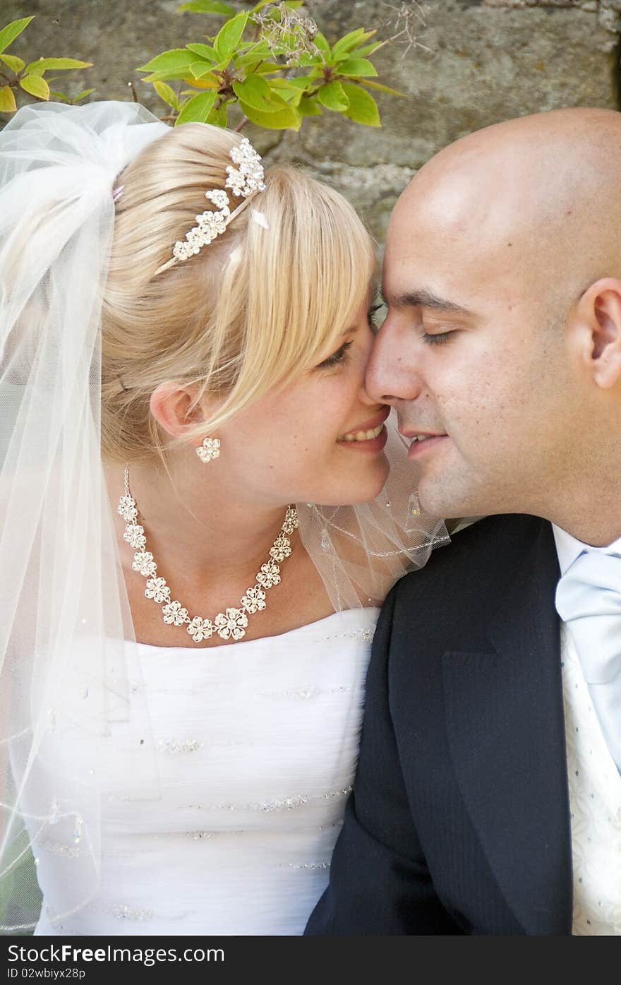 Intimate moment captured between a beautiful bride and groom