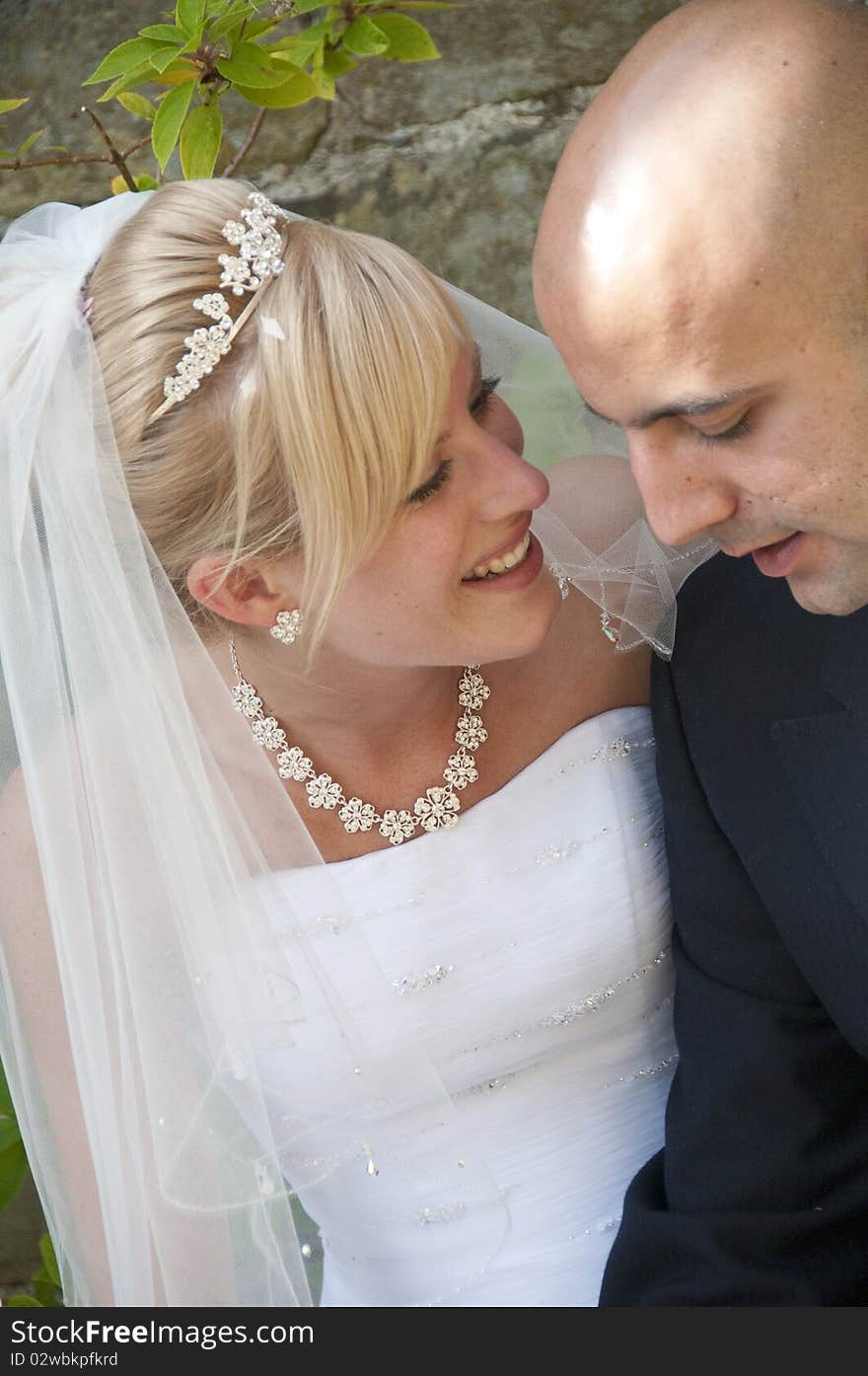 Intimate moment captured between a beautiful bride and groom