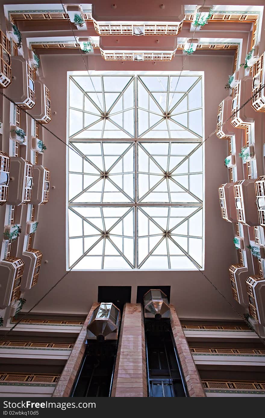 Bottom view on a glass ceiling of hotel