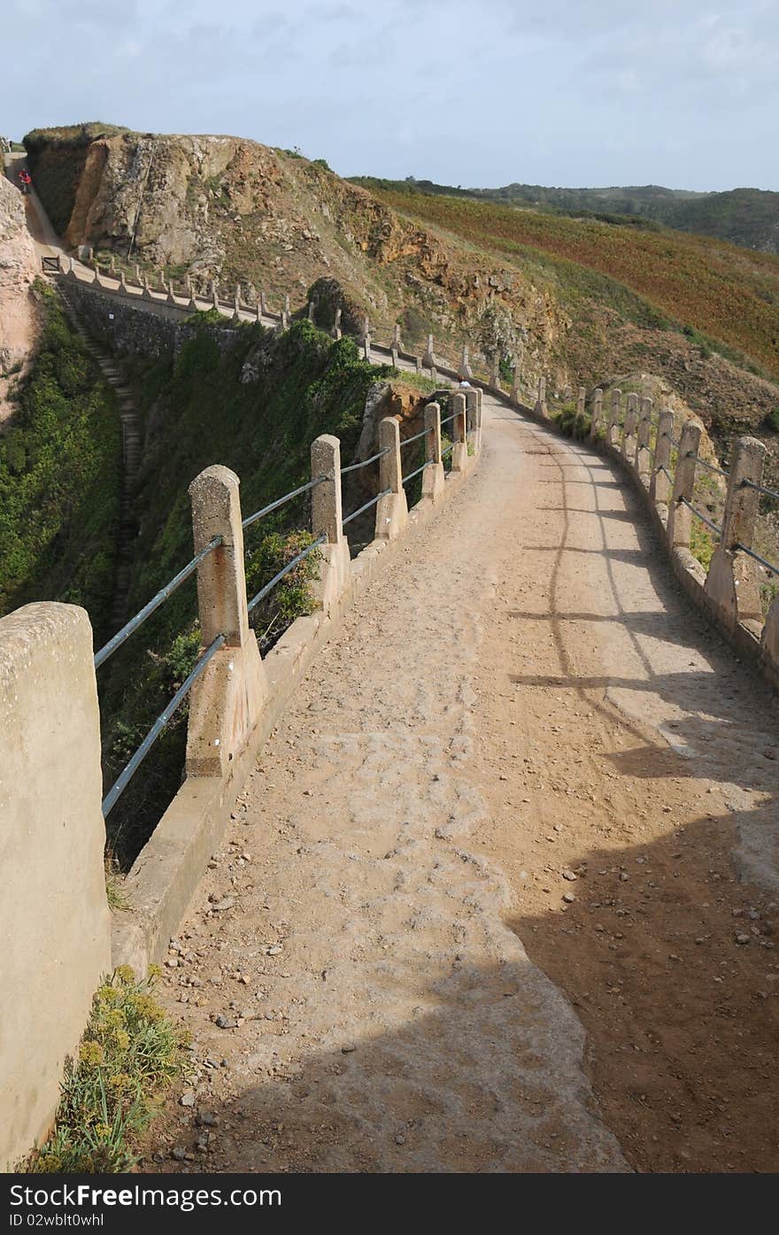 La Coupee causeway on Sark in the Channel Islands. La Coupee causeway on Sark in the Channel Islands