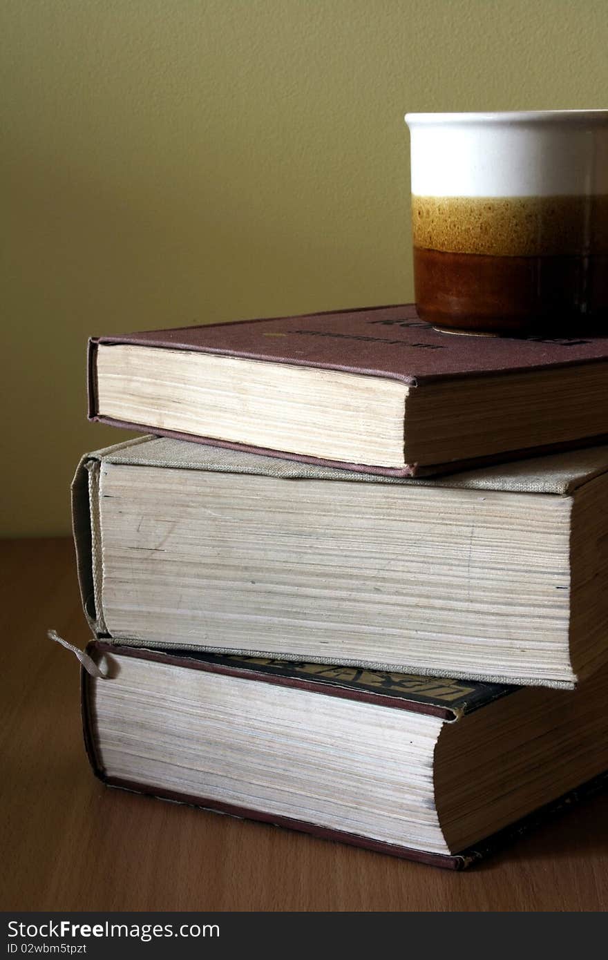 Books pile and coffee