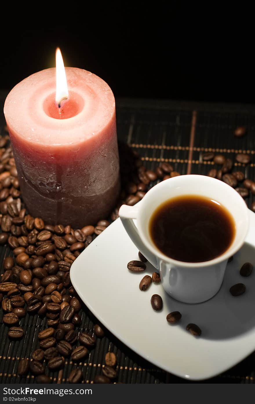 Candle and the cup of coffee.