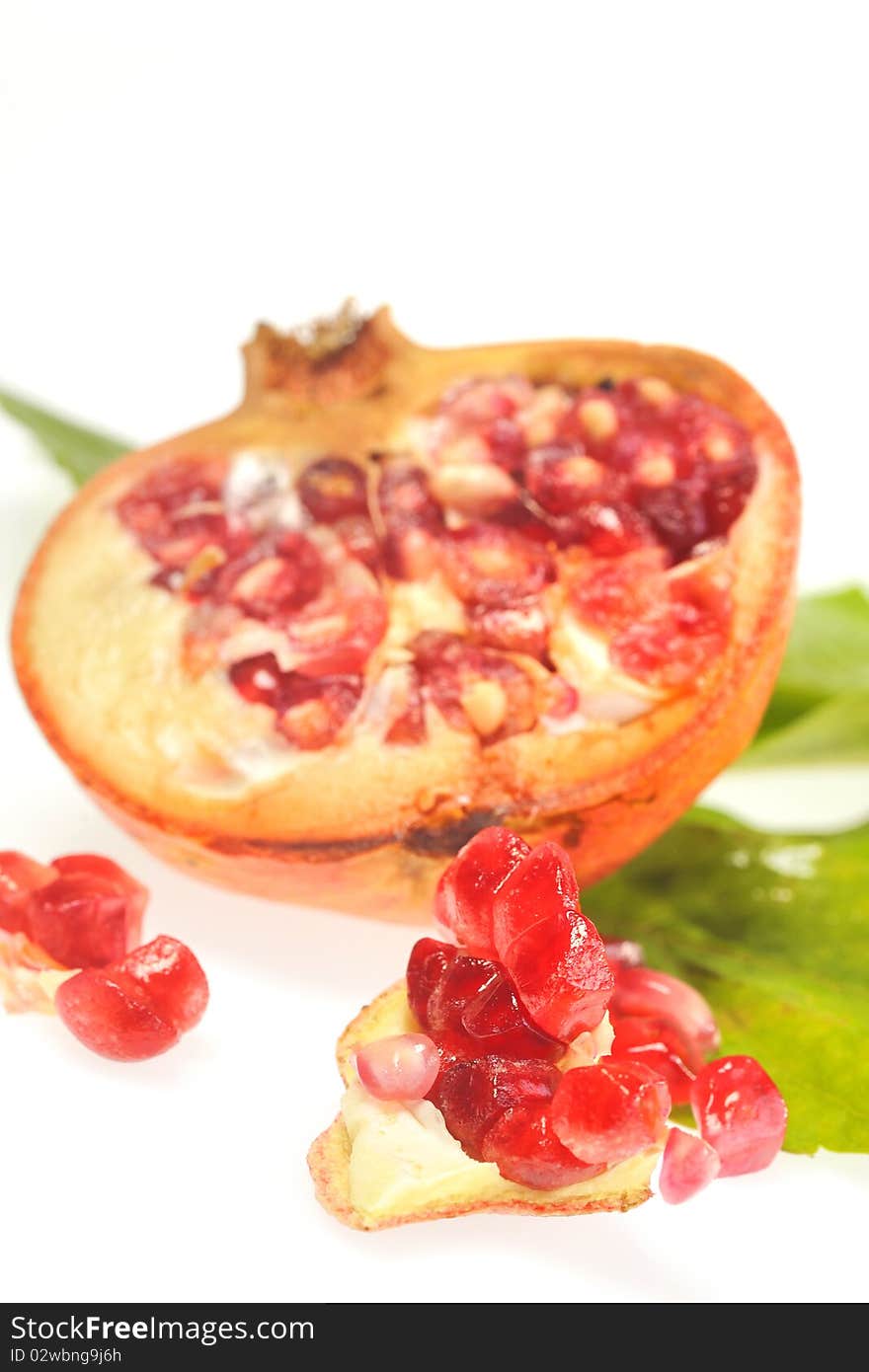 Pomegranates detail isolated on white background