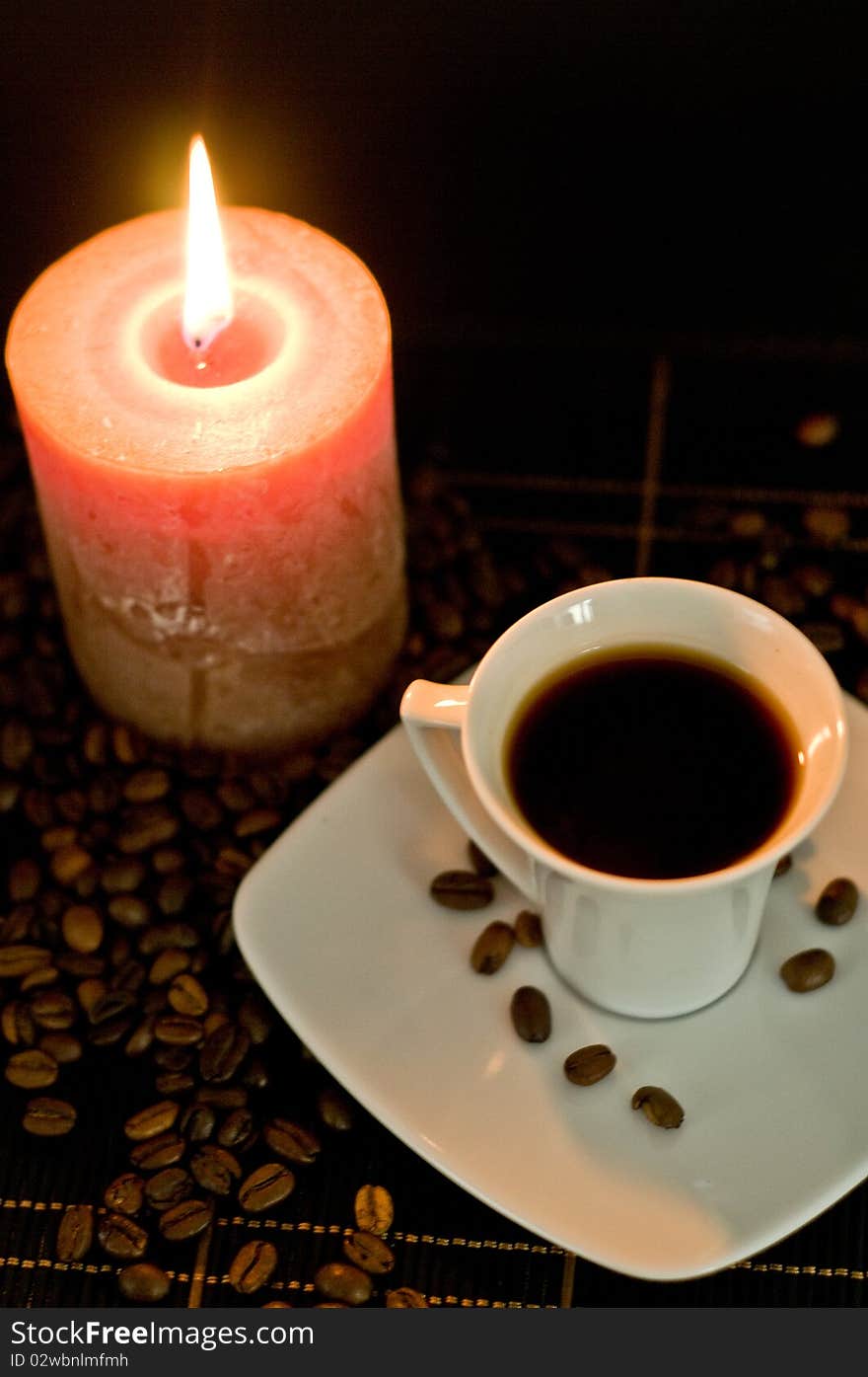 Candle and the cup of coffee.