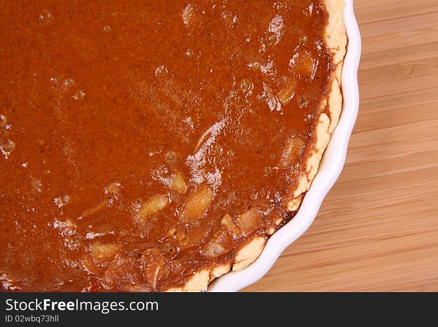 Pumpkin Pie on a wooden background in close up